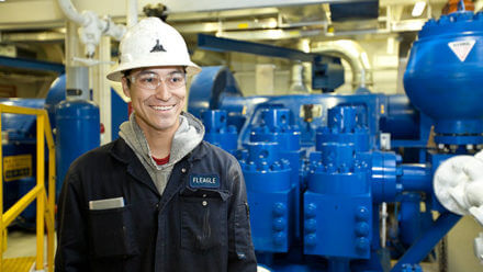 RP Drilling employee in hardhat and safety glasses.